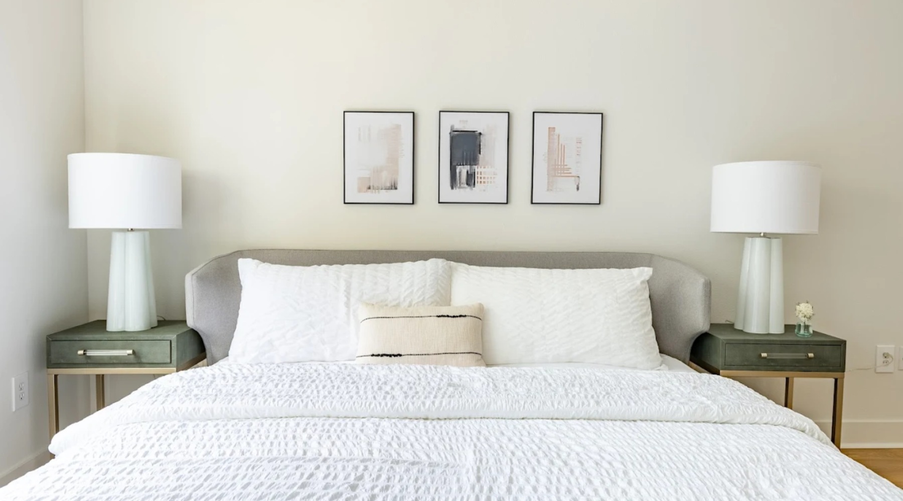 a bedroom with a bed and two nightstands