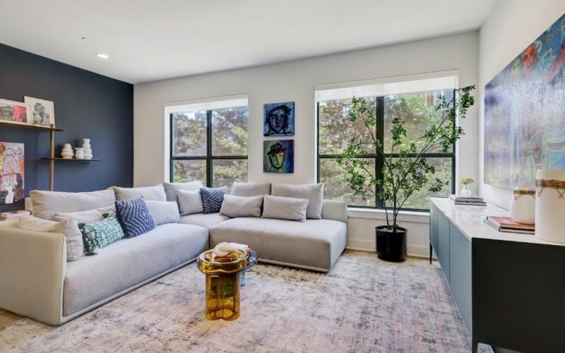 a living room with a white couch and a coffee table