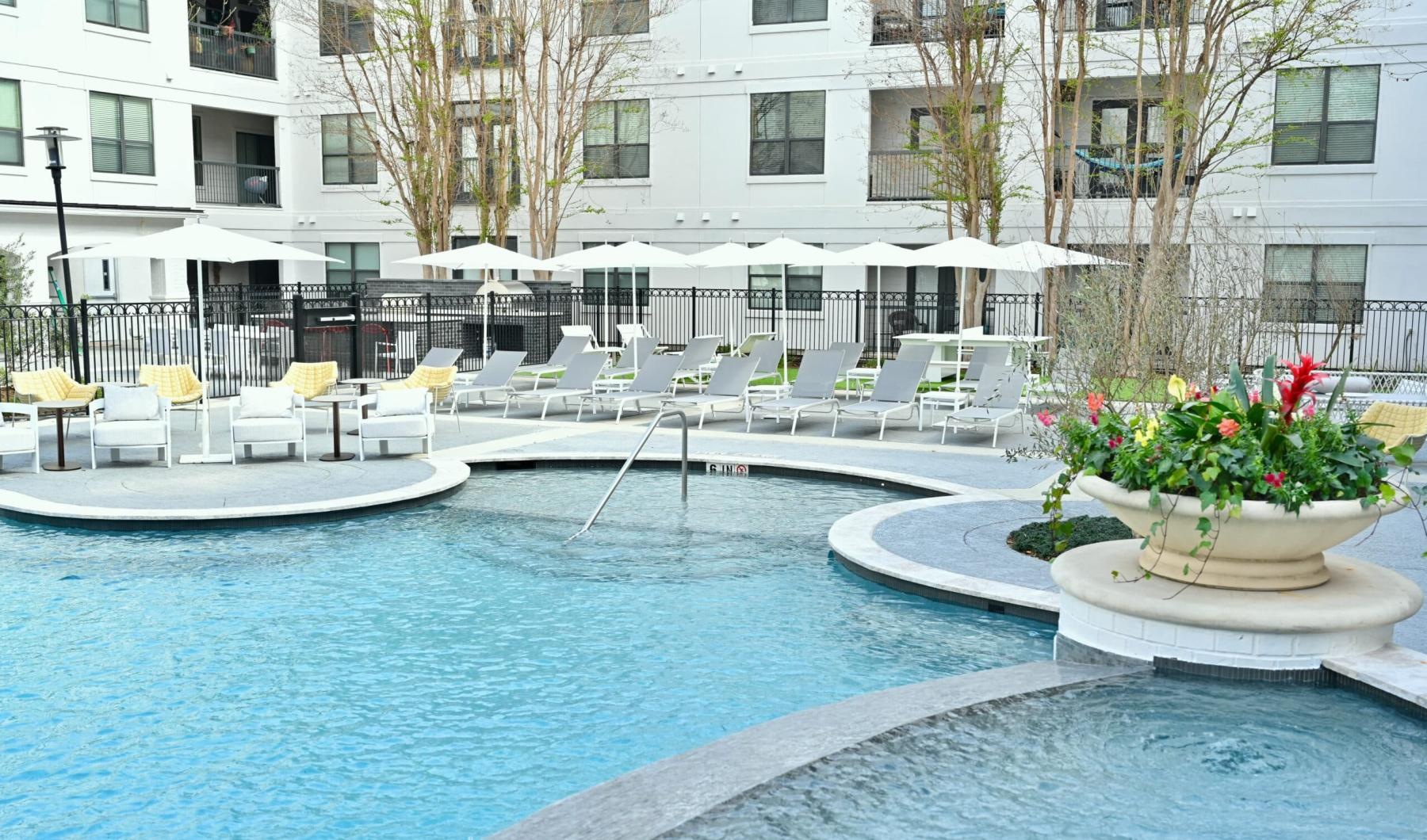 a pool with chairs around it